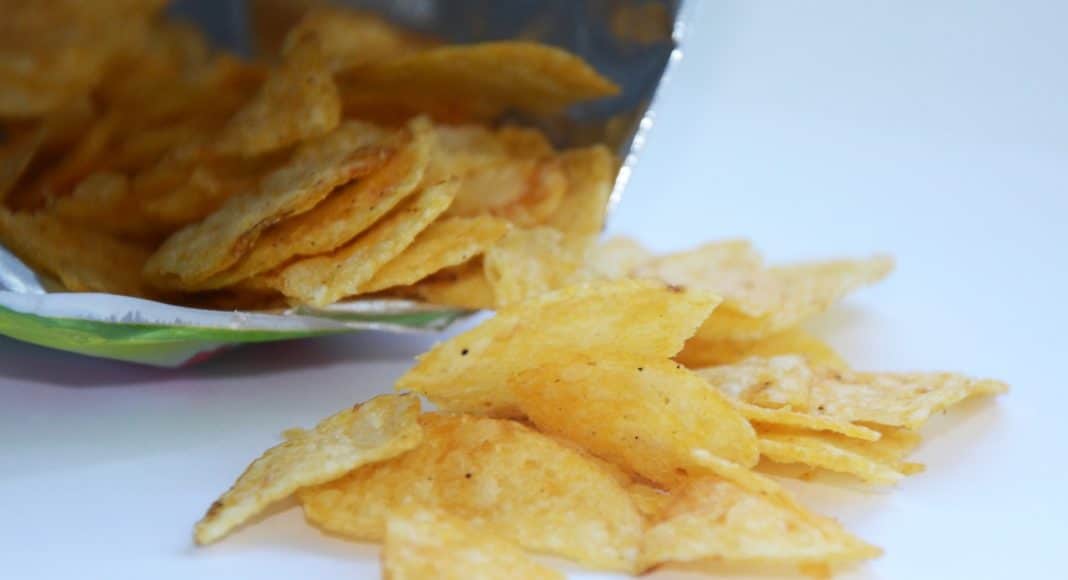 Potato chips spilling out of a bag
